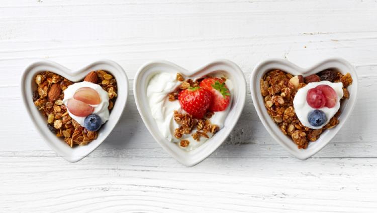 three heart shaped dishes of food