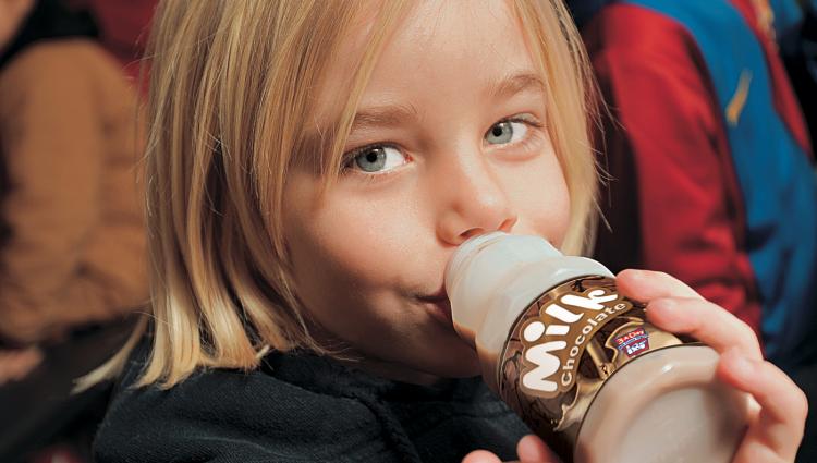little girl drinking chocolate milk