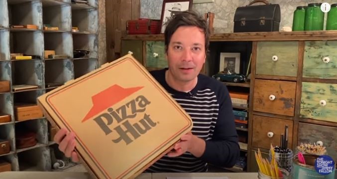 Jimmy Fallon with a box of Pizza Hut pizza