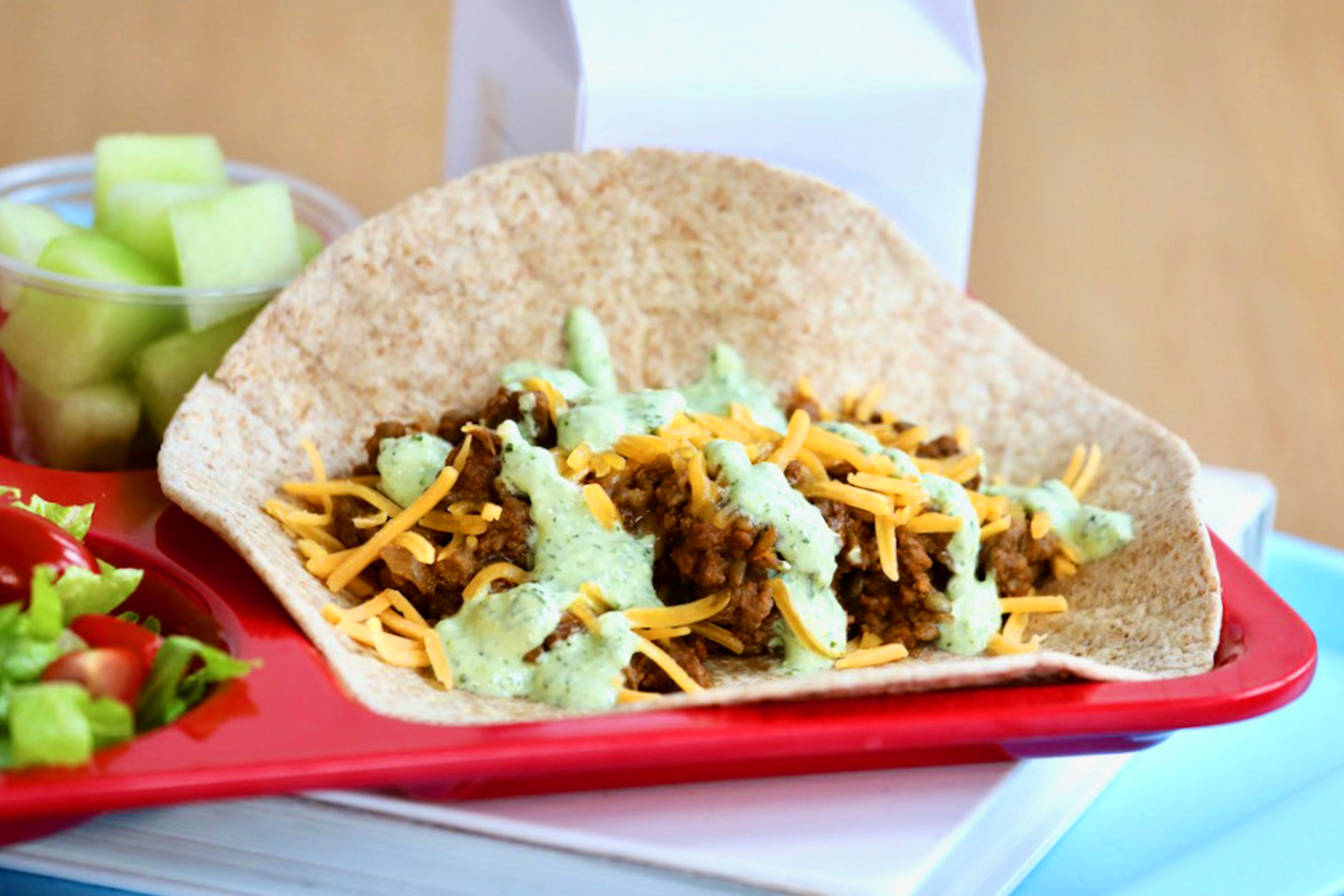 Beef and lentil taco with cilantro yogurt sauce