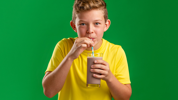 Boy drinking chocolate milk