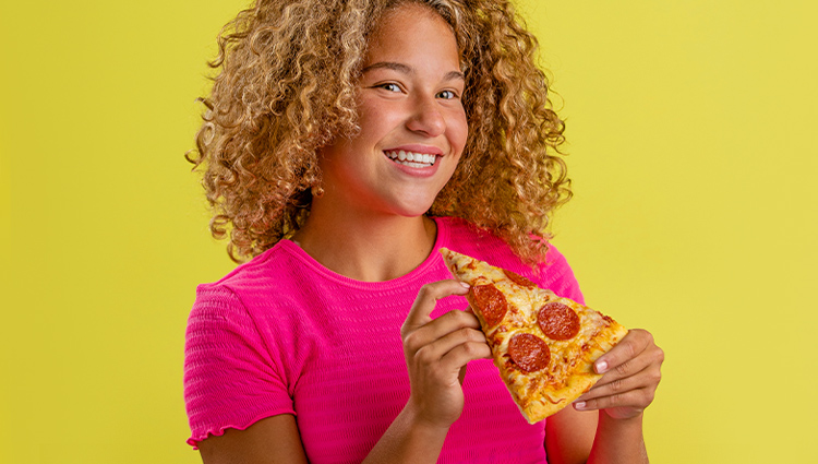 Woman eating pizza