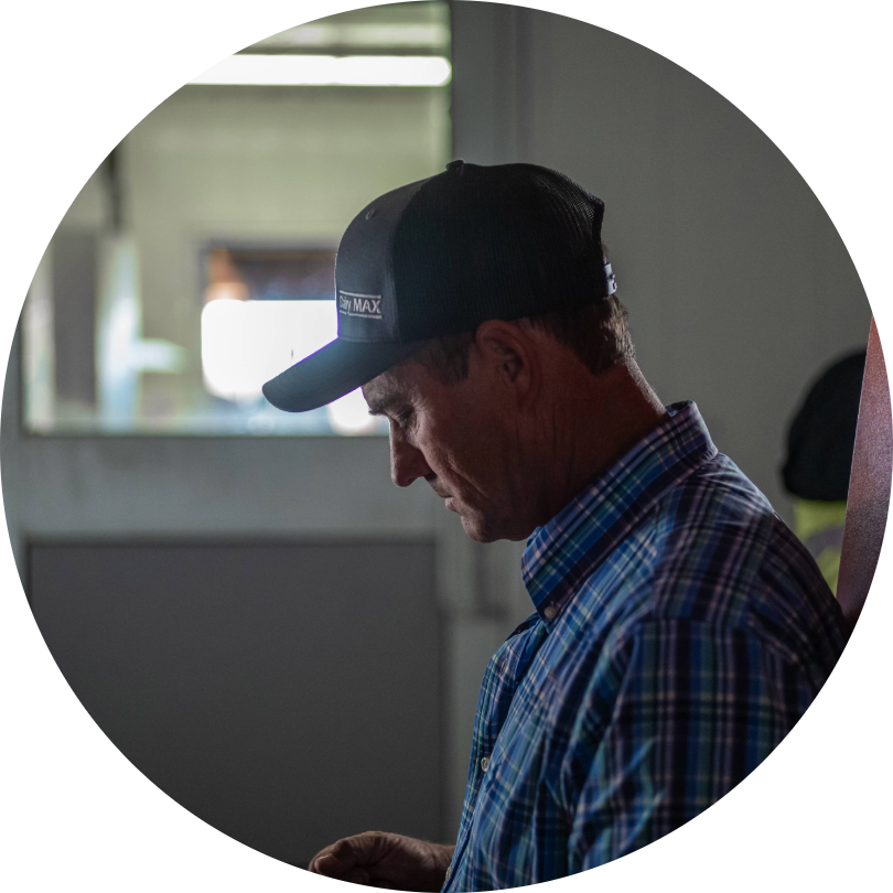 Dairy farmer looking at phone