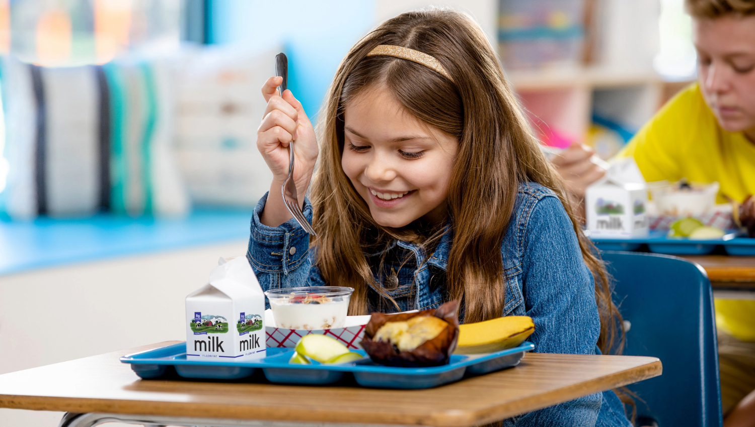 Student eats meal in classroom