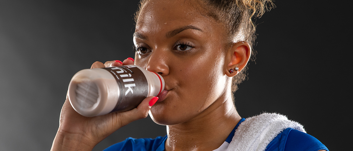 Athlete drinking chocolate milk.