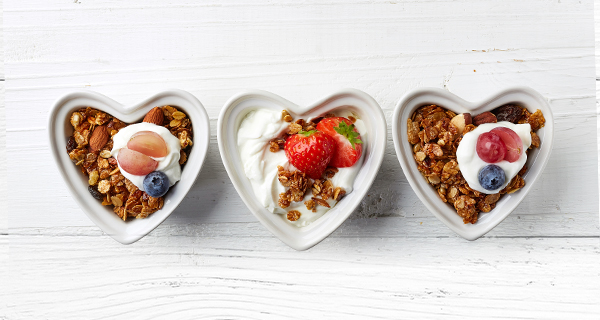 three heart shaped dishes of food