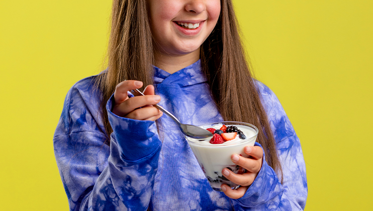 woman eating yogurt