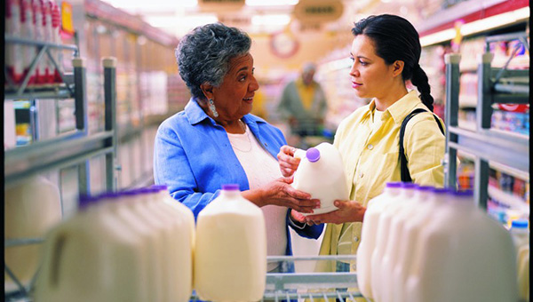 discussing milk at the grocery store