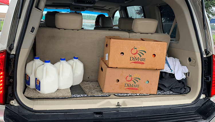 Cars pick up food at the food bank