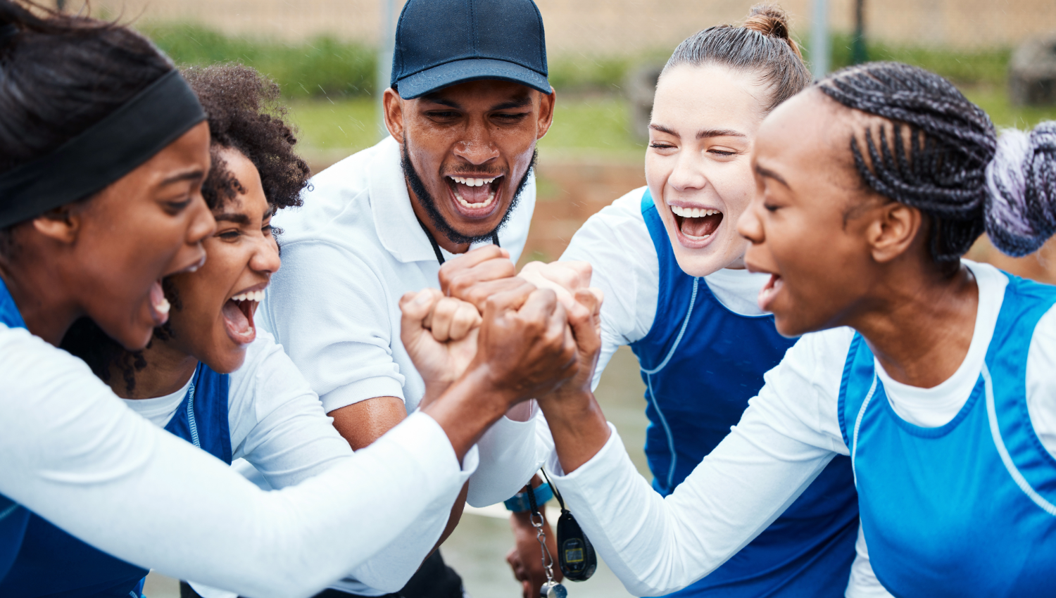 Student athletes with coach outside