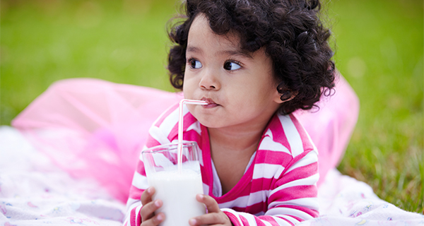 young child drinking milk