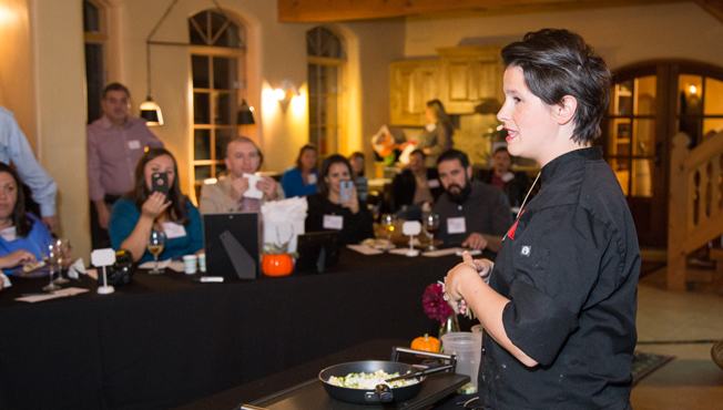 chef caitlin speaks to a group