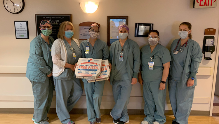 group of health pros eating dominos