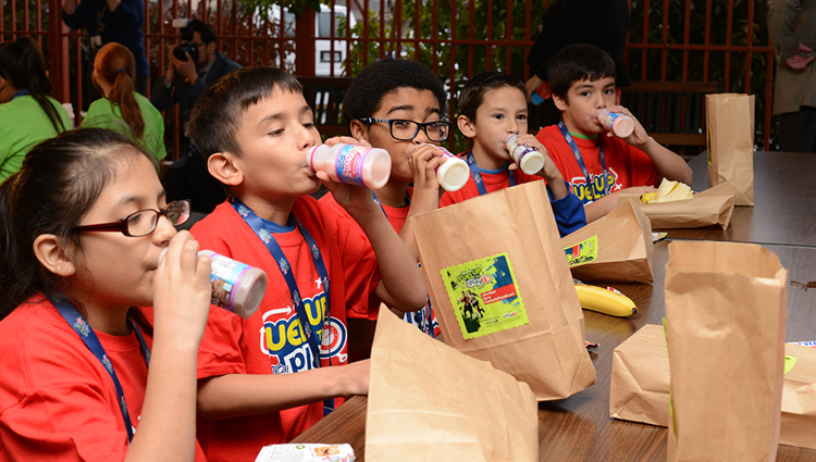 students drinking milk at school