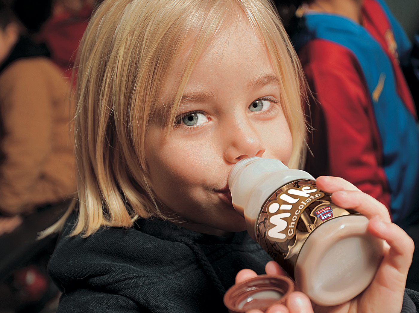 little girl drinking chocolate milk