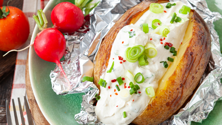 Baked potato loaded with sour cream