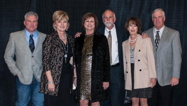 group of people dressed up posing for a picture