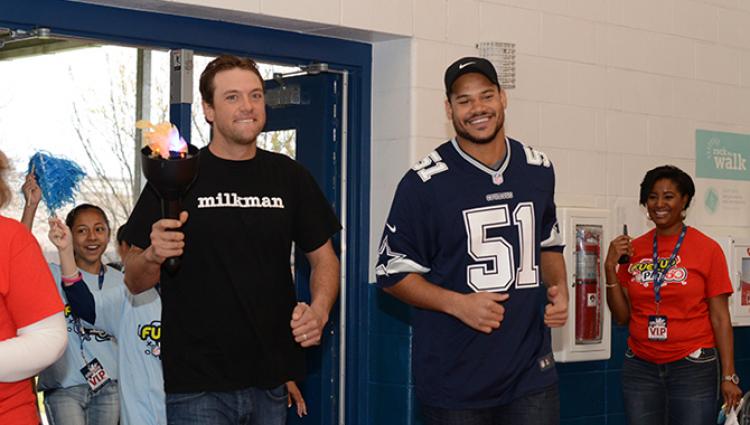 two men participating in breakfast games