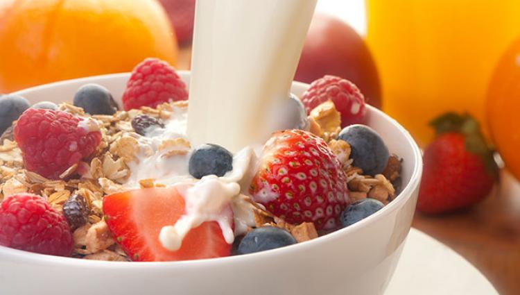 bowl of cereal and fruit with milk